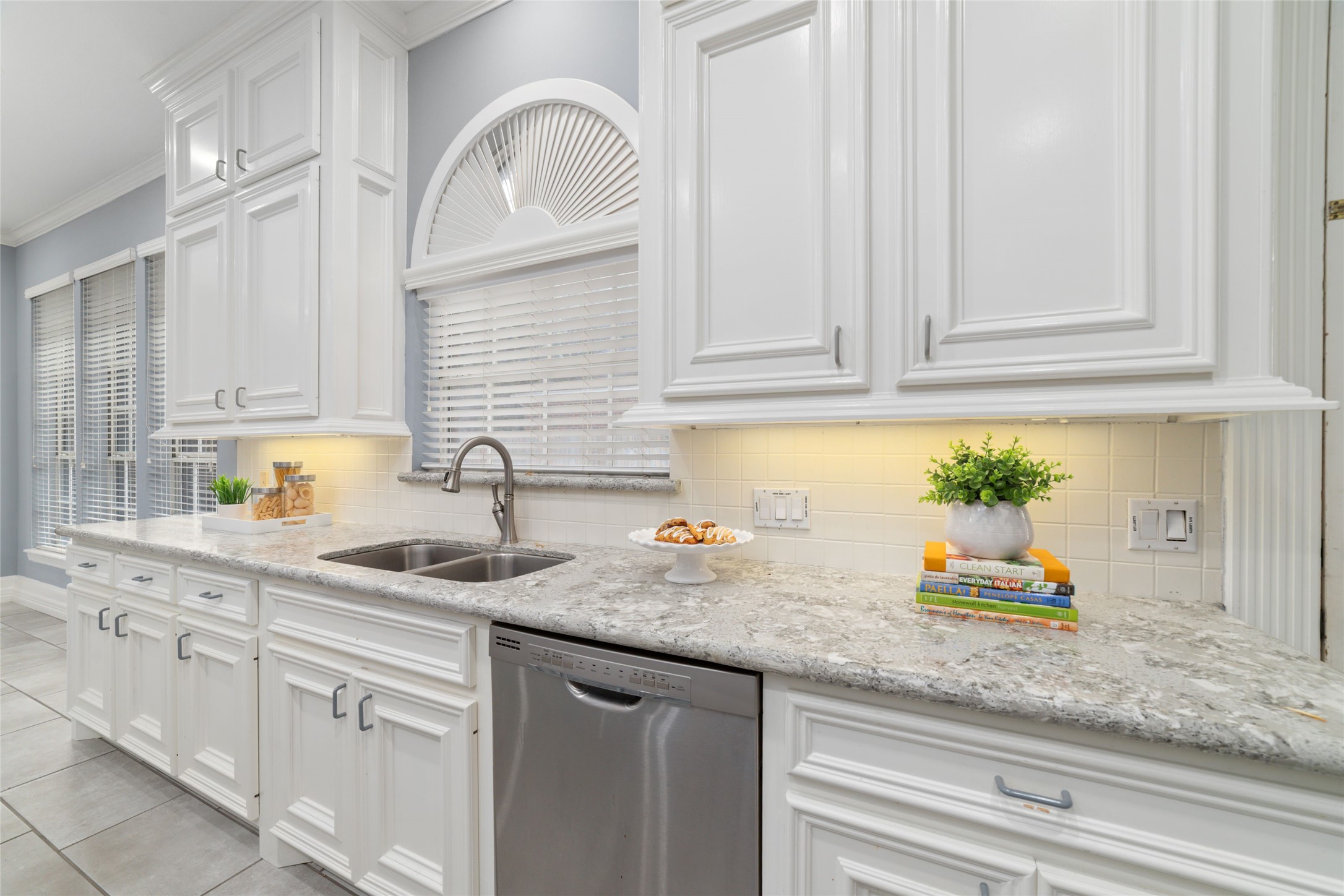 16114 Lafone Drive Spring, TX 77379 - Photo 10 of 45 Beautiful cabinetry and expansive granite countertops provide plenty of workspace and storage.