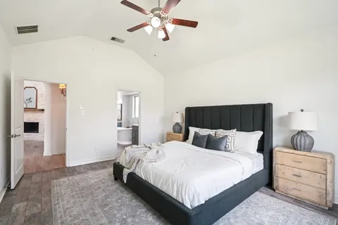 a bathroom with a sink mirror and toilet