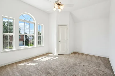 a view of a hallway with paintings on the wall