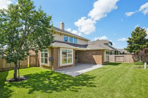 a view of outdoor space with brick wall