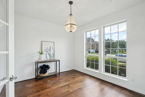 a view of an entryway with wooden floor