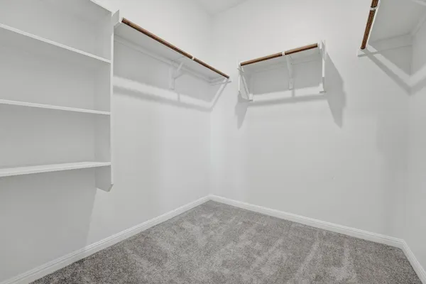 a view of an empty walk in closet