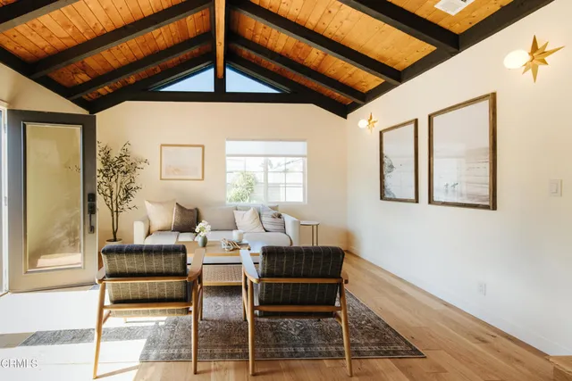 a view of kitchen island with furniture and wooden floor