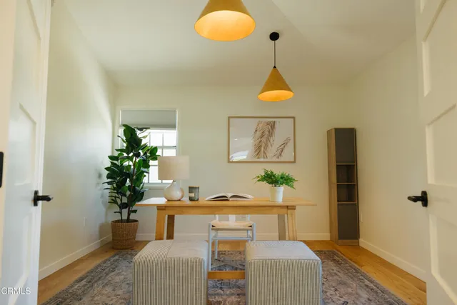 a large bed sitting in a bedroom next to a lamp