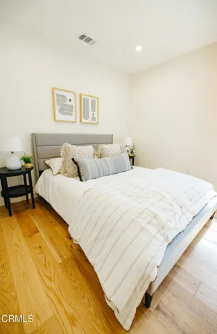 a bedroom with a bed and a table