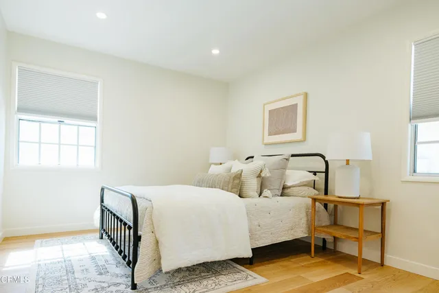 a bathroom with a sink mirror and a bathtub