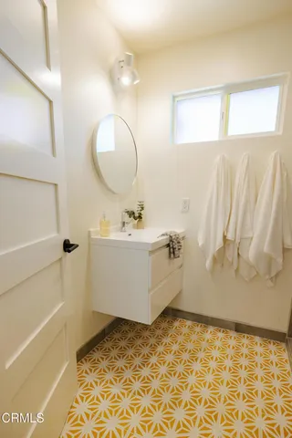 a bathroom with a granite countertop shower and a toilet