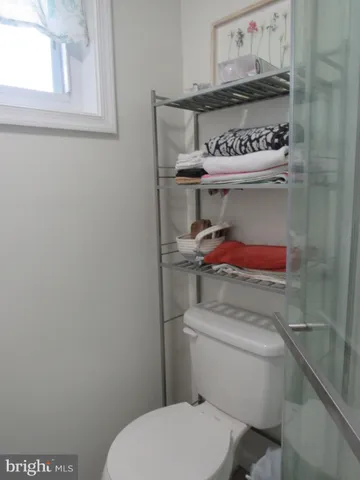 a bathroom with a toilet and a sink