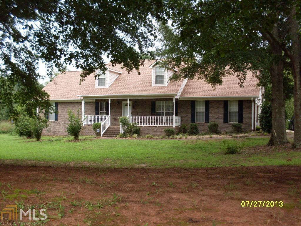107 Cardell Farms Road Locust Grove, GA 30248 - Photo 1 of 1 a front view of a house with a garden