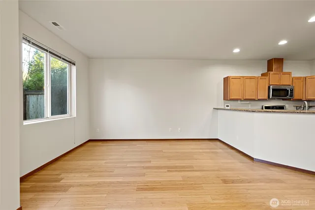 a view of a kitchen with a sink and a window