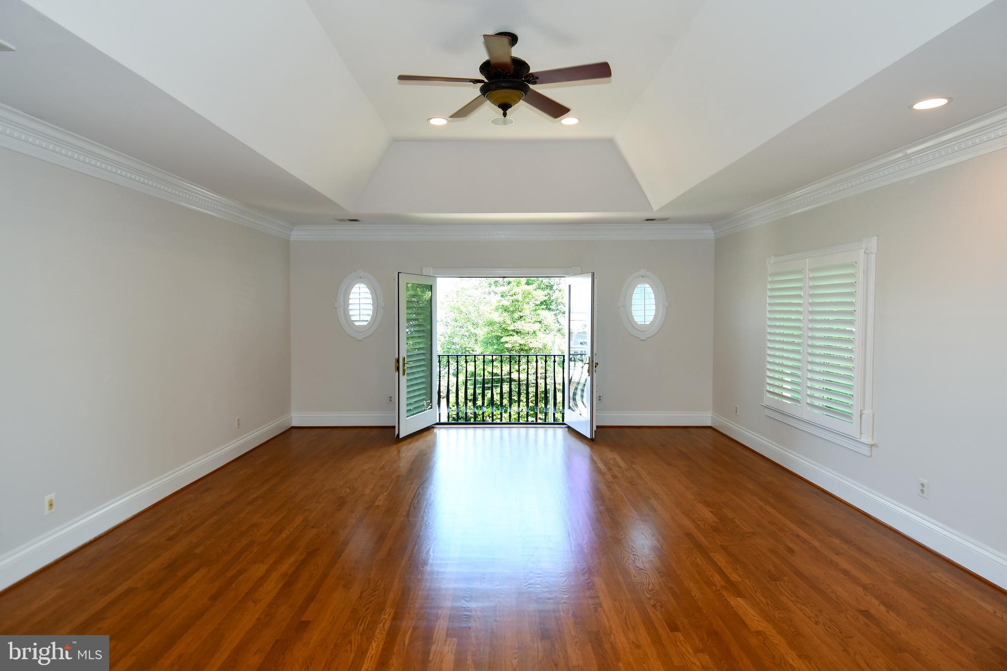 7808 Southdown Road Alexandria, VA 22308 - Photo 60 of 99 a view of an empty room with wooden floor and a window