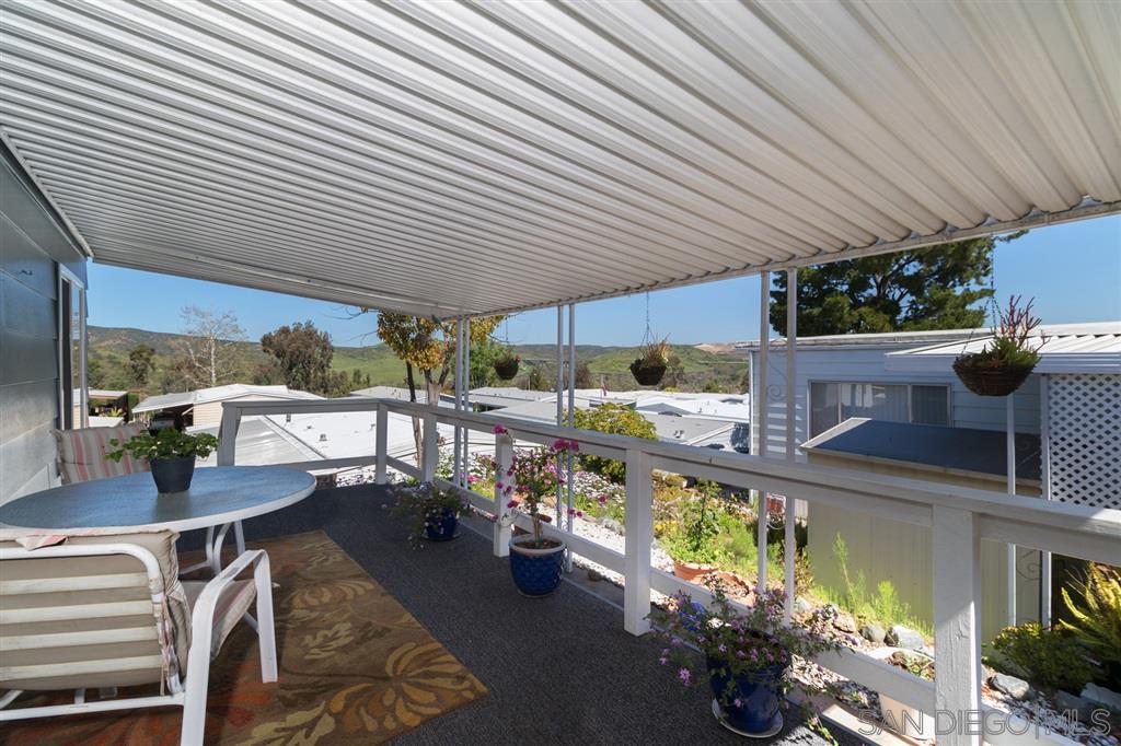7467 Mission Gorge Road, Unit 161 Santee, CA 92071 - Photo 22 of 25 Even the Porch has a lovely view. The owner loves watching the birds from this space.