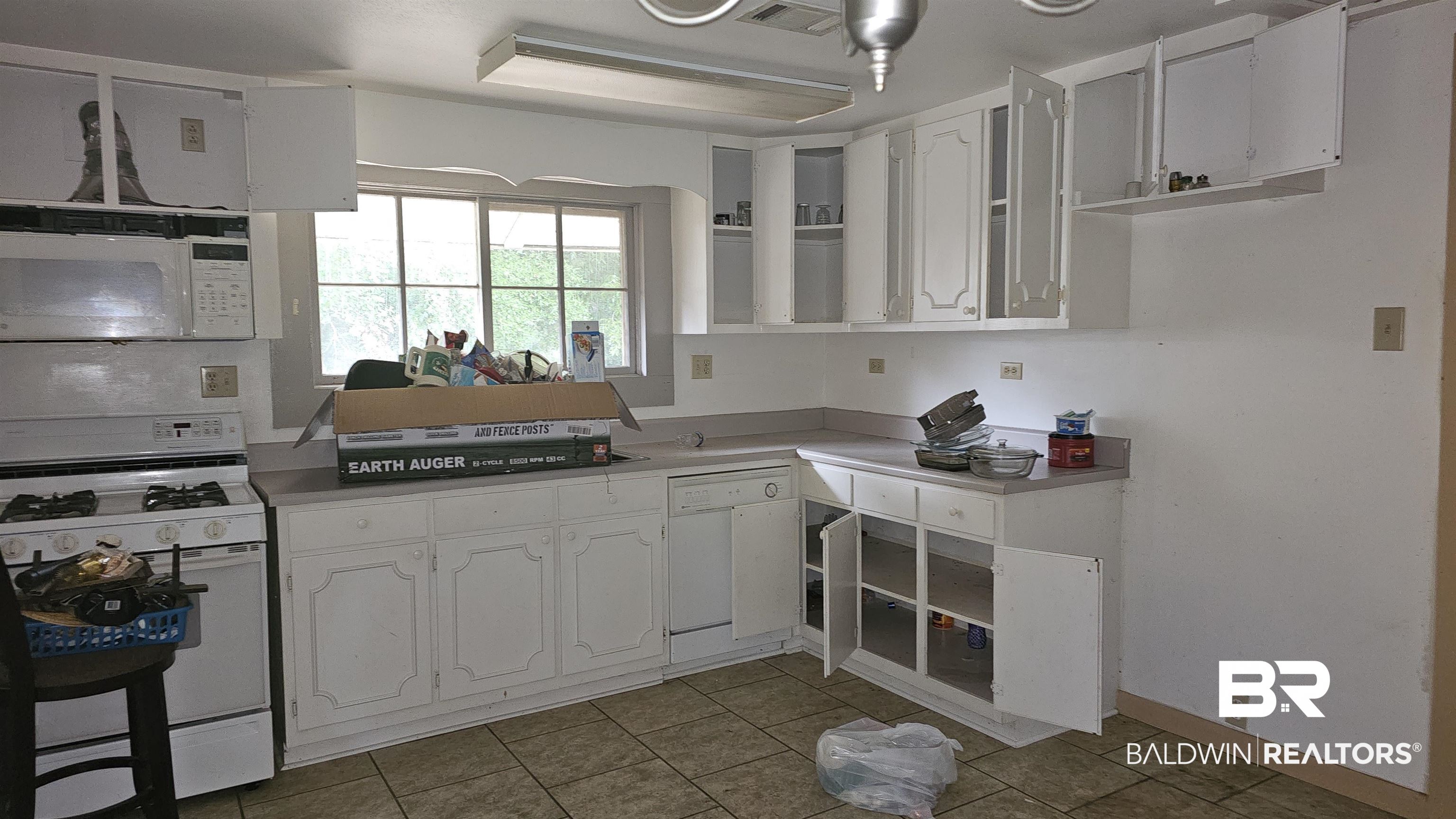 307 Scott Street Brewton, AL 36426 - Photo 6 of 19 Kitchen featuring white appliances and white cabinets