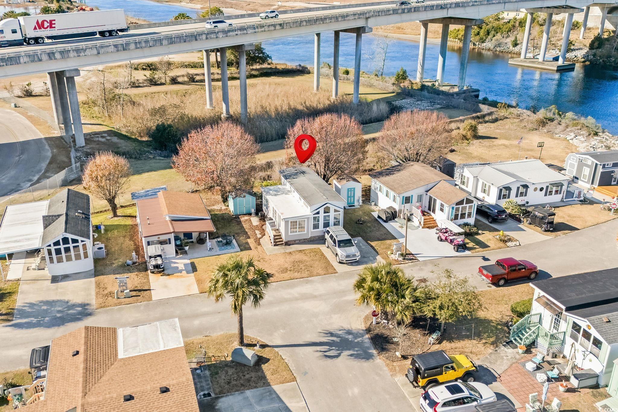 137 Riptide Circle North Myrtle Beach, SC 29582 - Photo 24 of 32 Aerial view of residential area with a nearby body of water