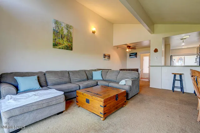 a living room with furniture and a lamp