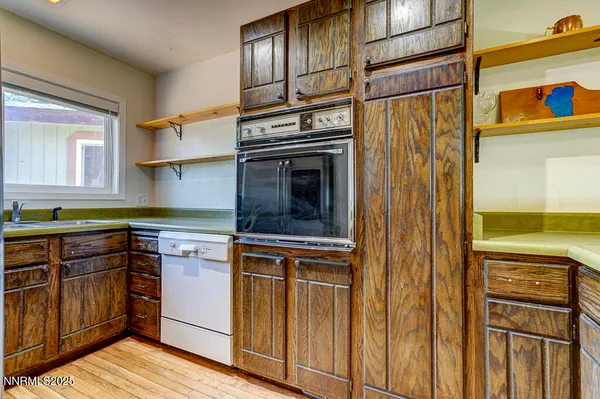 a kitchen with stainless steel appliances granite countertop a stove and a refrigerator