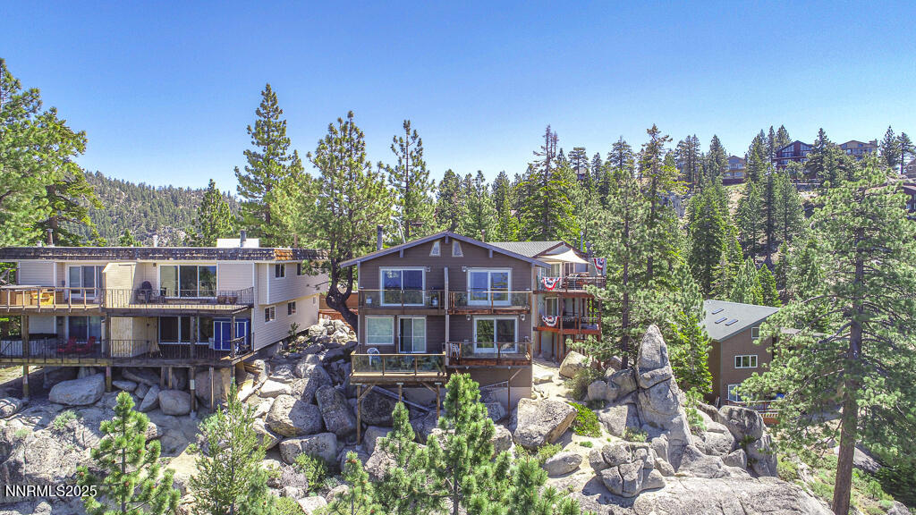 710 Tina Court, Unit B2 Stateline, NV 89449 - Photo 22 of 25 a view of a house with swimming pool and sitting area