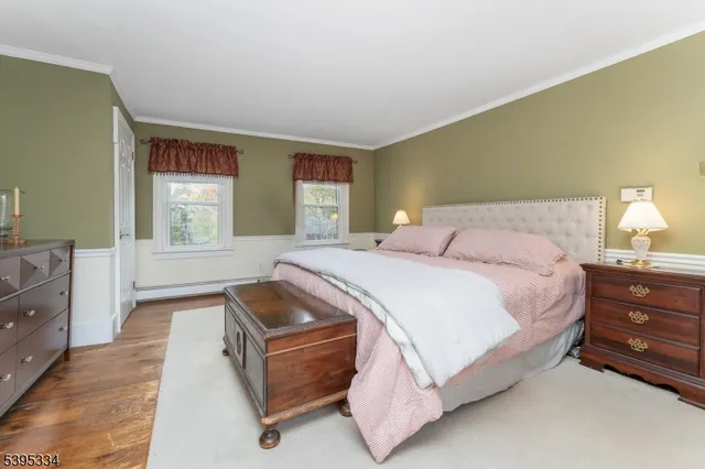 a spacious bedroom with a bed and window