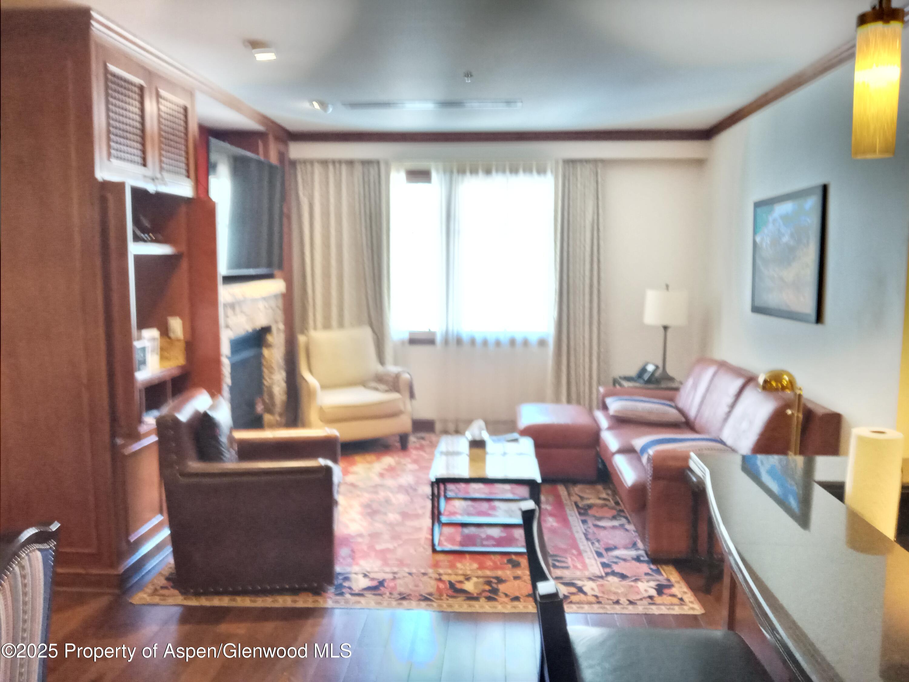 75 Prospector Road, Unit 8404 WINTER INTEREST #5 Aspen, CO 81611 - Photo 30 of 38 a living room with furniture and a large window