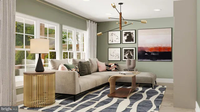 a living room with furniture kitchen view and a large window