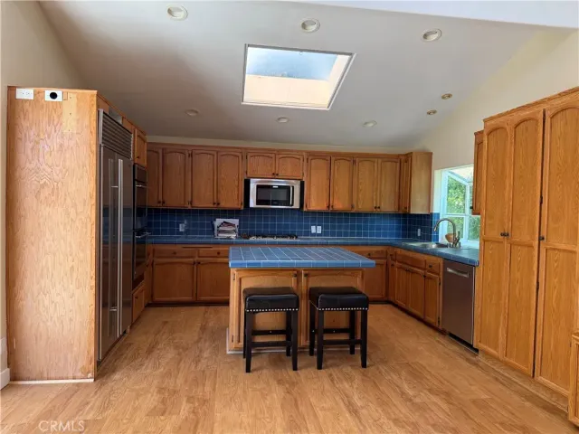 a view of a entryway door with wooden floor