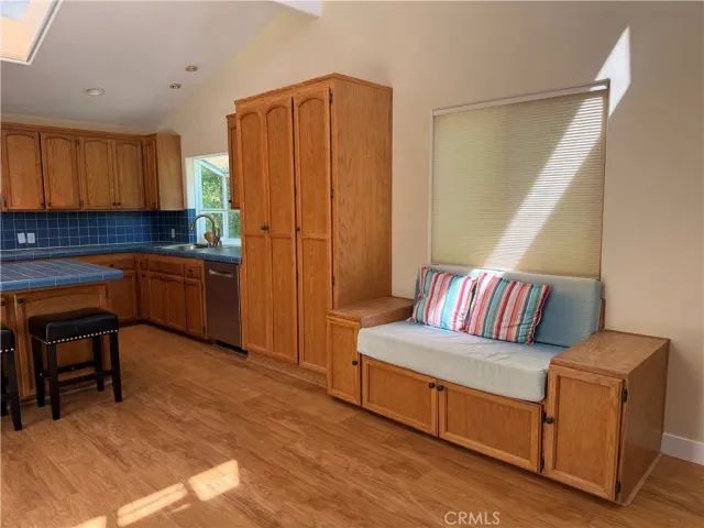 a white toilet sitting next to a bathroom sink and vanity