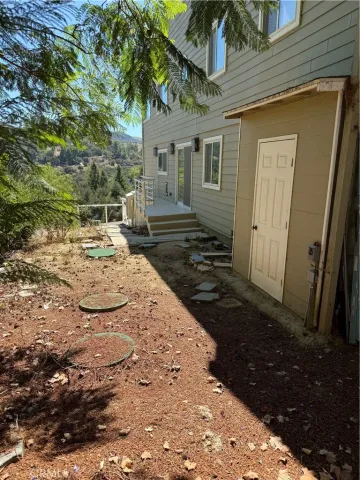 a living room with furniture and a piano