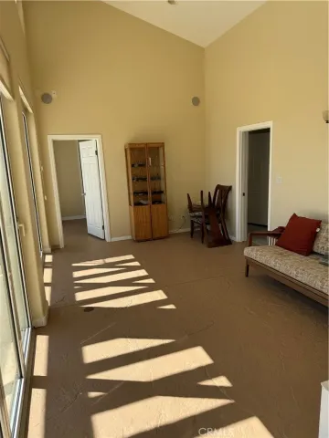 a view of a glass door with a chair