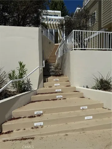 a backyard of a house with yard and outdoor seating