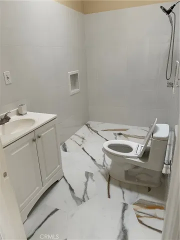 a bathroom with a toilet a sink and a window