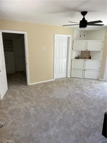 a bed room with a bed and a window