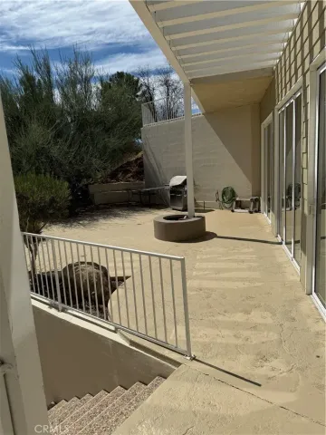 a view of balcony with furniture