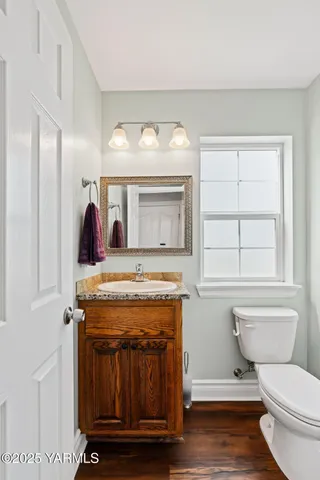 a living room with a stove and a window