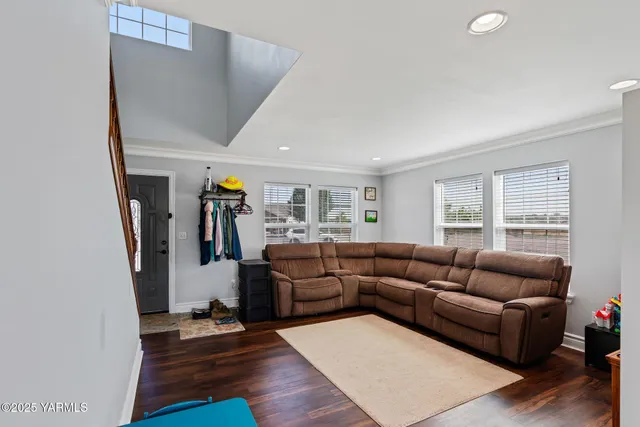 a living room with furniture and a window
