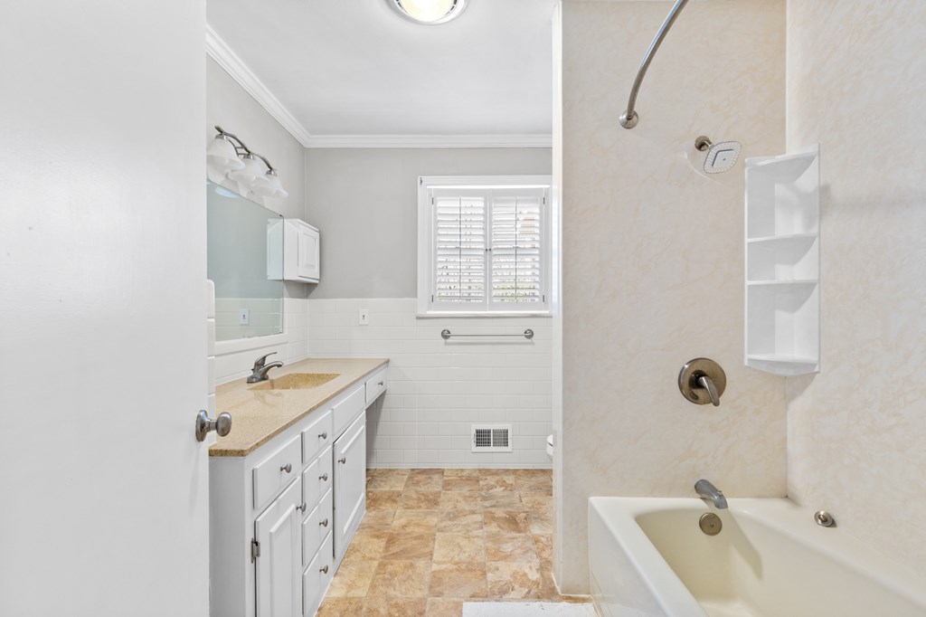 3920 Blue Ridge Drive Blue Ridge, GA 30513 - Photo 14 of 22 a bathroom with a tub sink and mirror