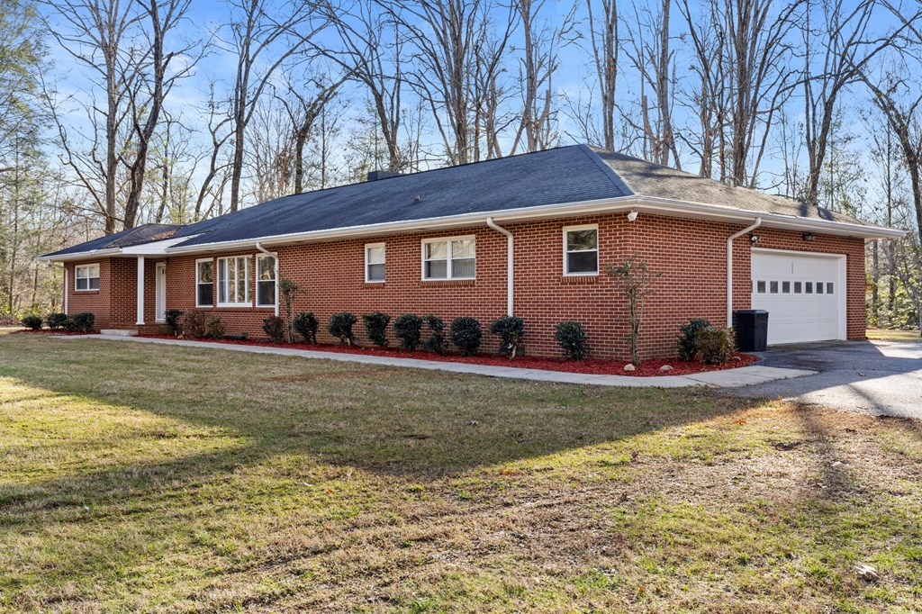 3920 Blue Ridge Drive Blue Ridge, GA 30513 - Photo 20 of 22 a view of a house with a yard