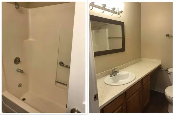 a bathroom with a sink vanity mirror and shower