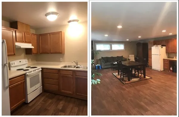 a kitchen with stainless steel appliances granite countertop a stove top oven a sink dishwasher and a refrigerator with wooden floor