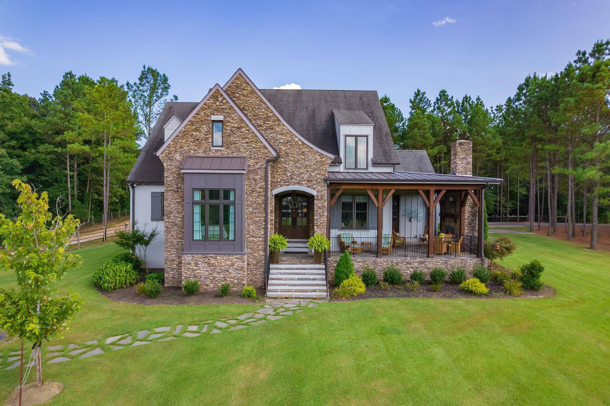 a front view of a house with garden