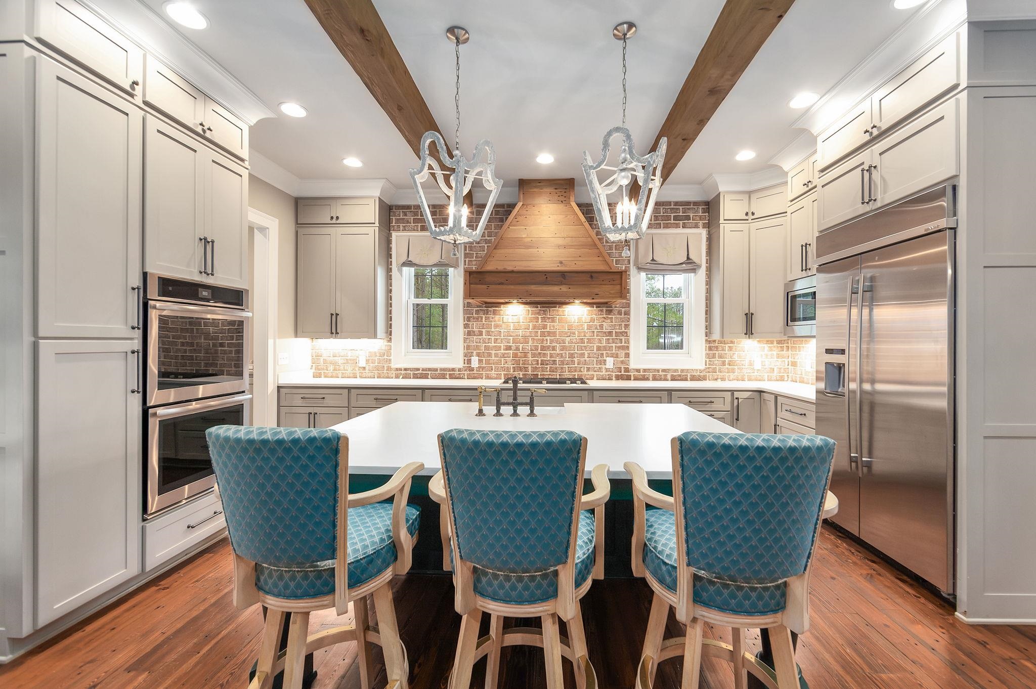 348 Countryside Drive Lexington, TN 38351 - Photo 12 of 39 a view of a dining room with furniture large window and wooden floor