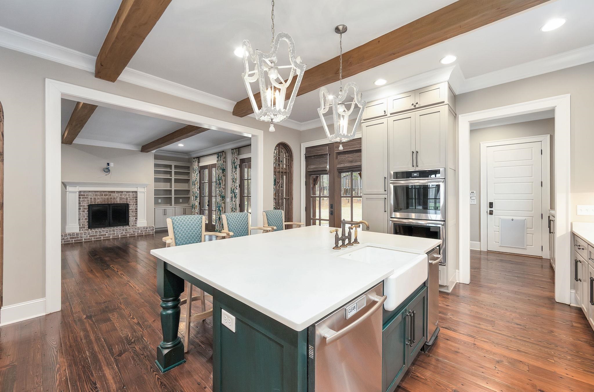 348 Countryside Drive Lexington, TN 38351 - Photo 16 of 39 a large kitchen with kitchen island a large island in it