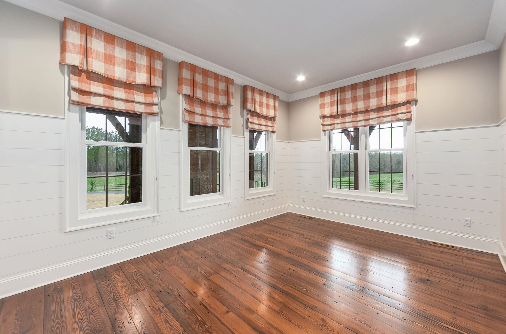 348 Countryside Drive Lexington, TN 38351 - Photo 18 of 39 a view of an empty room with a window and wooden floor
