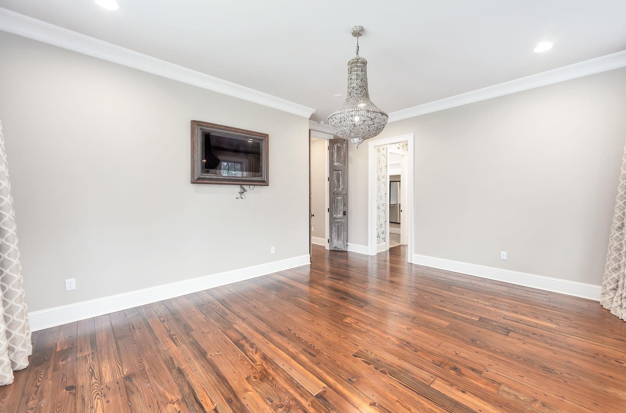 348 Countryside Drive Lexington, TN 38351 - Photo 20 of 39 a view of a livingroom with wooden floor and a ceiling fan