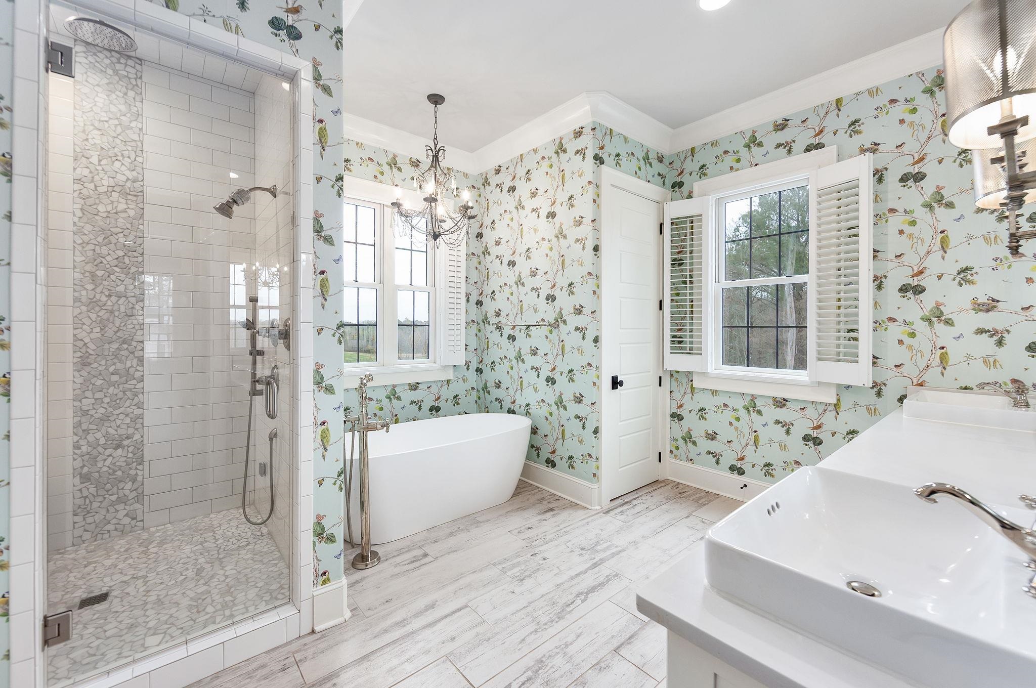 348 Countryside Drive Lexington, TN 38351 - Photo 21 of 39 a bathroom with a bathtub and a shower