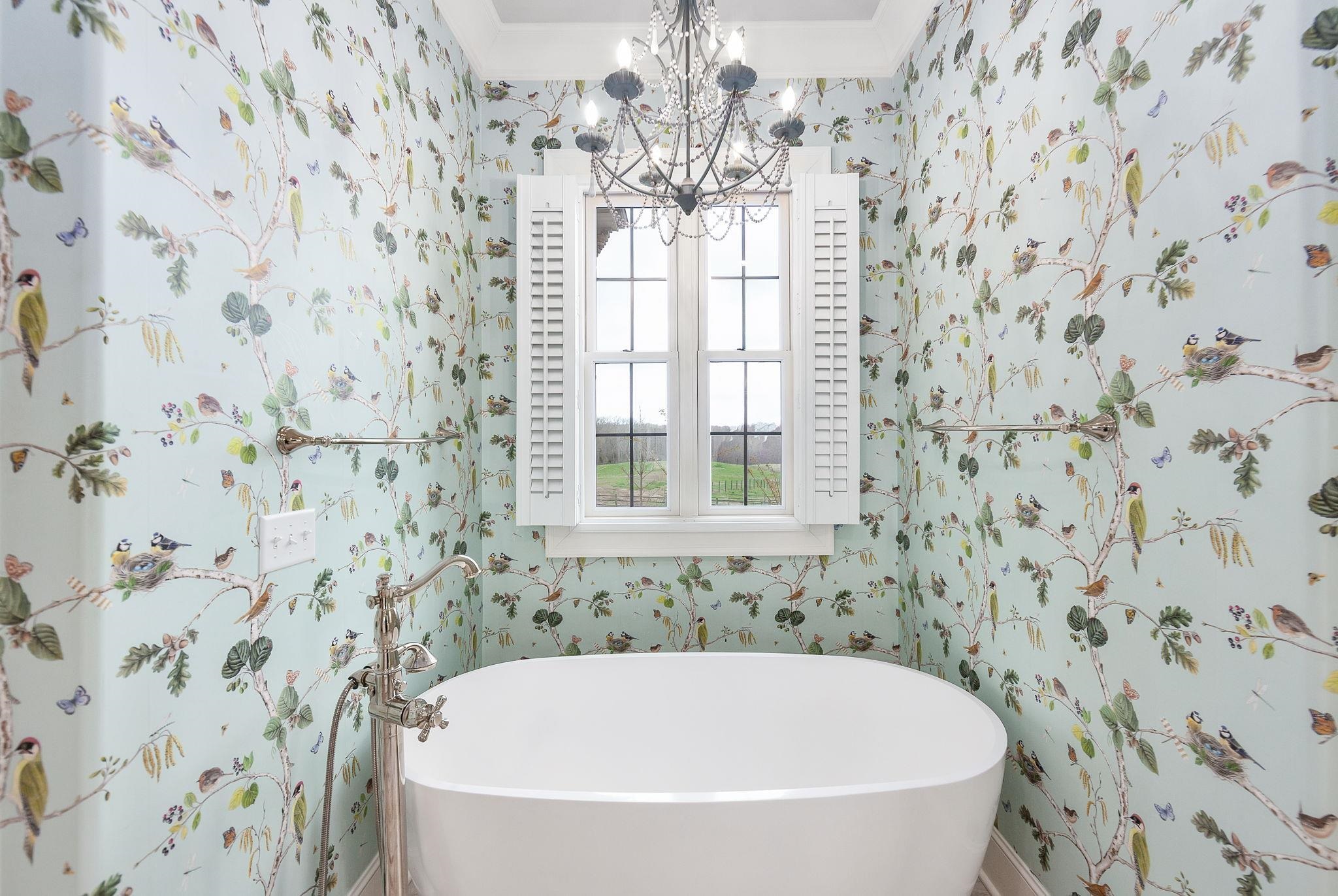 348 Countryside Drive Lexington, TN 38351 - Photo 23 of 39 a white bath tub sitting next to a shower curtain