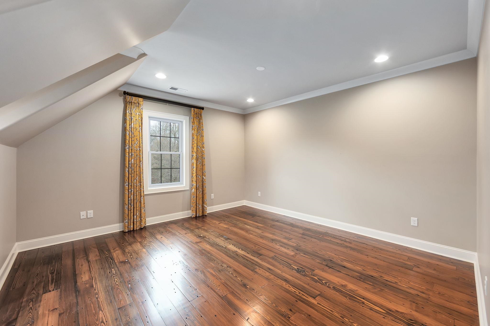 348 Countryside Drive Lexington, TN 38351 - Photo 26 of 39 a view of an empty room with wooden floor and a window