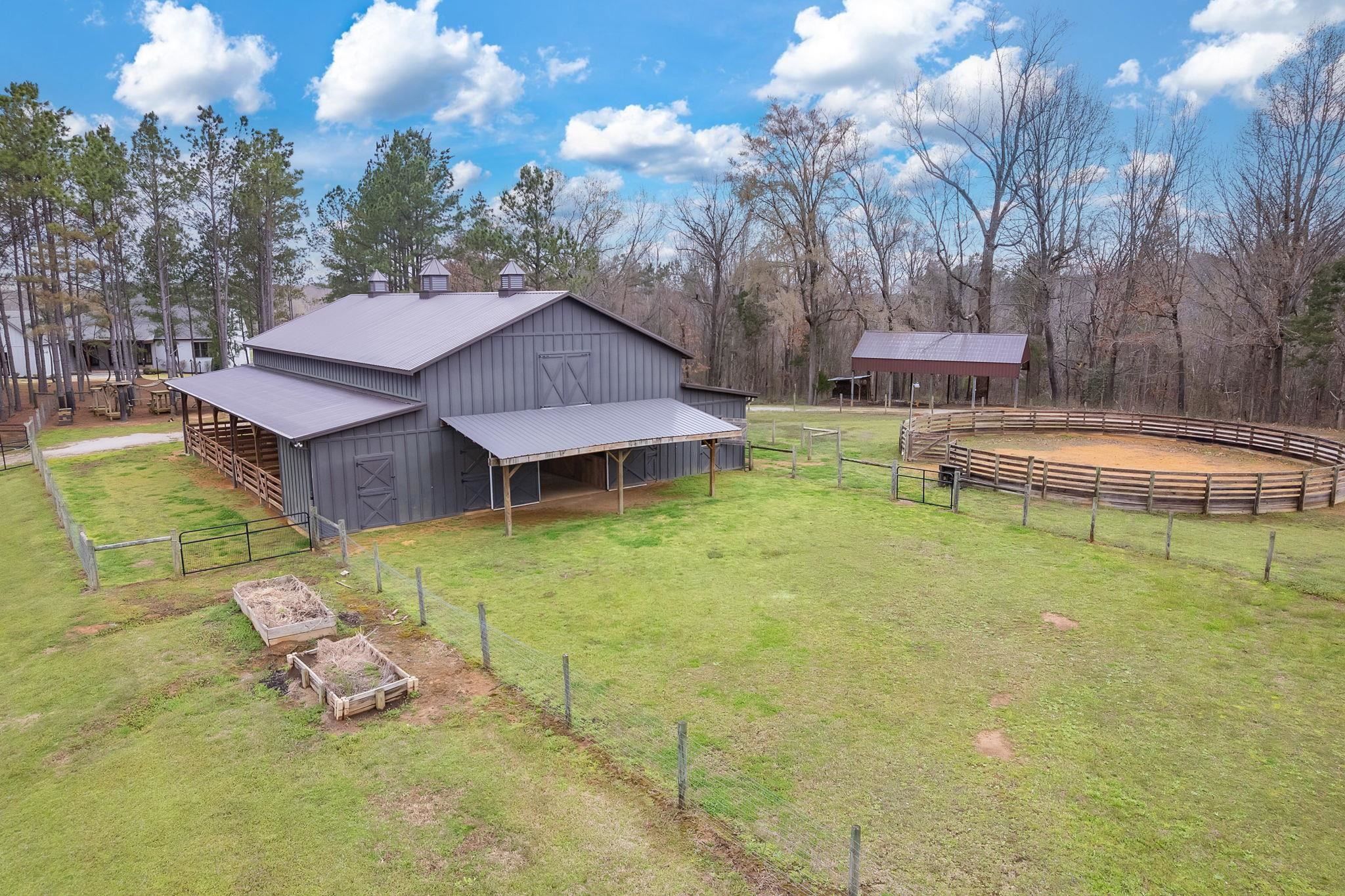 348 Countryside Drive Lexington, TN 38351 - Photo 31 of 39 a view of a house with pool and a yard
