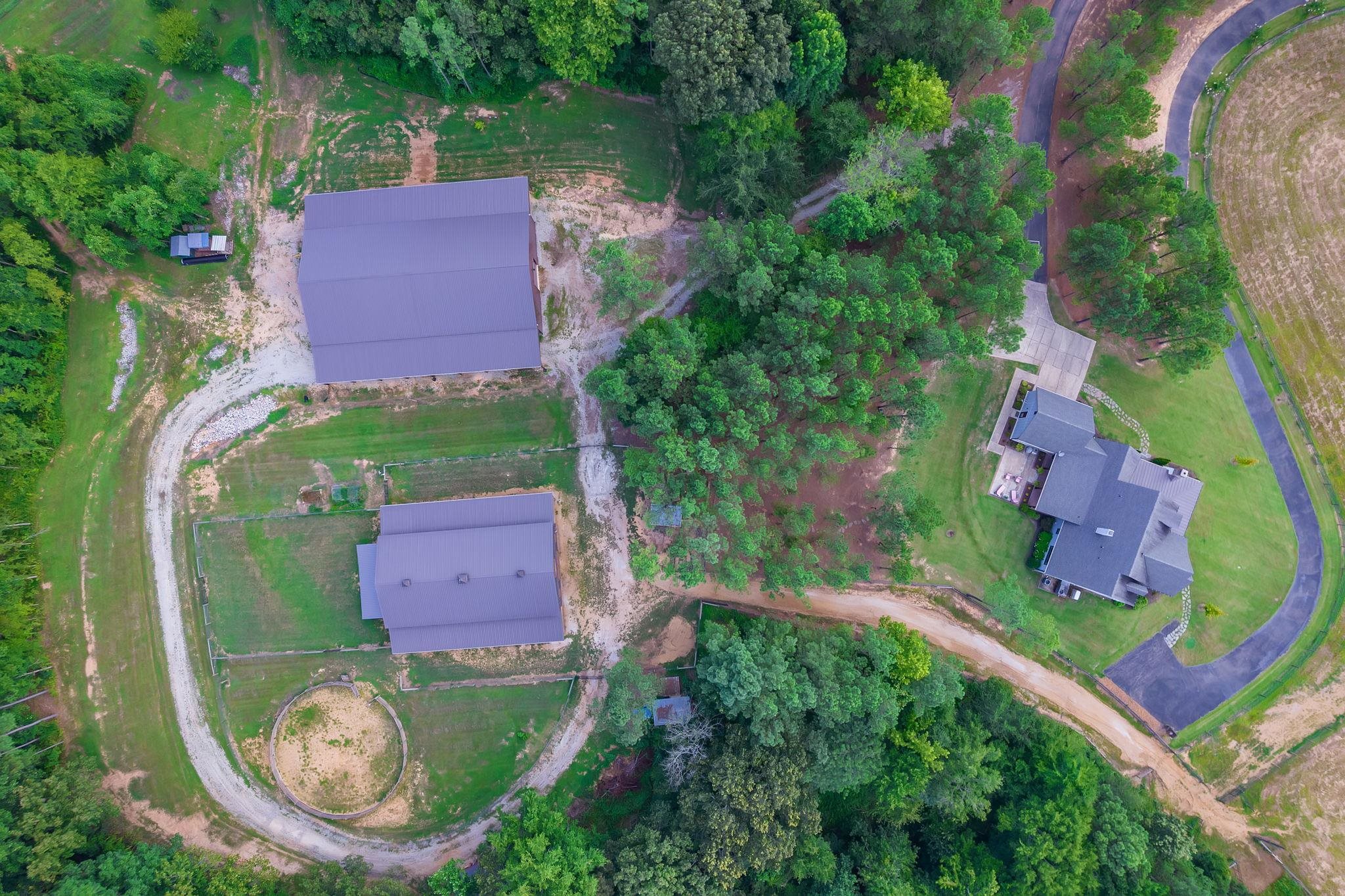 348 Countryside Drive Lexington, TN 38351 - Photo 35 of 39 an aerial view of a house with a garden and lake view