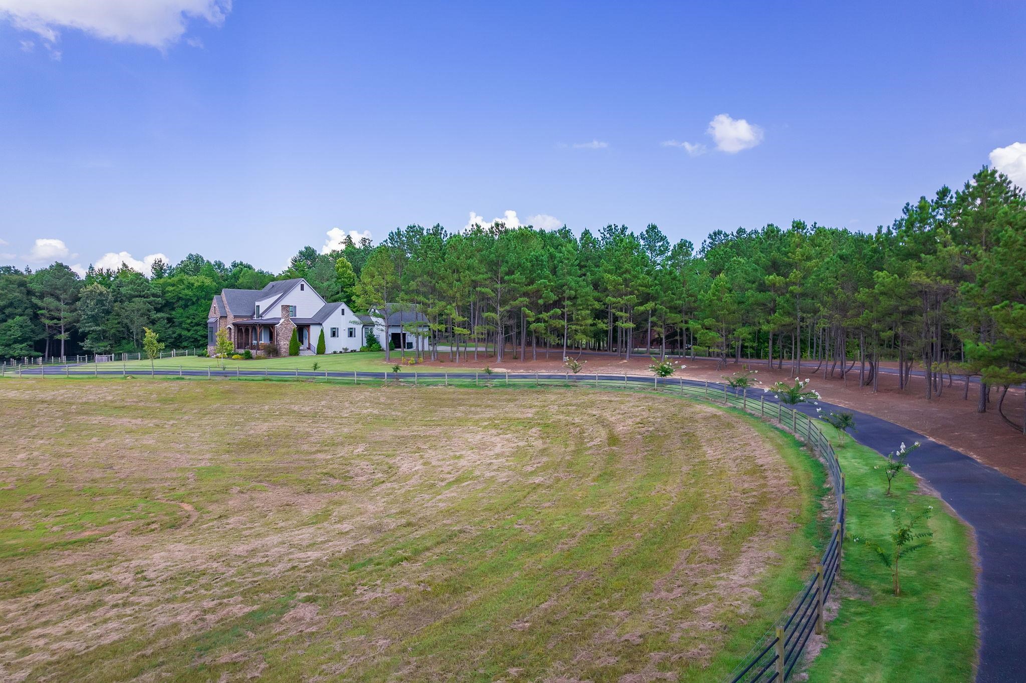 348 Countryside Drive Lexington, TN 38351 - Photo 4 of 39 a view of a swimming pool with an outdoor space and seating area