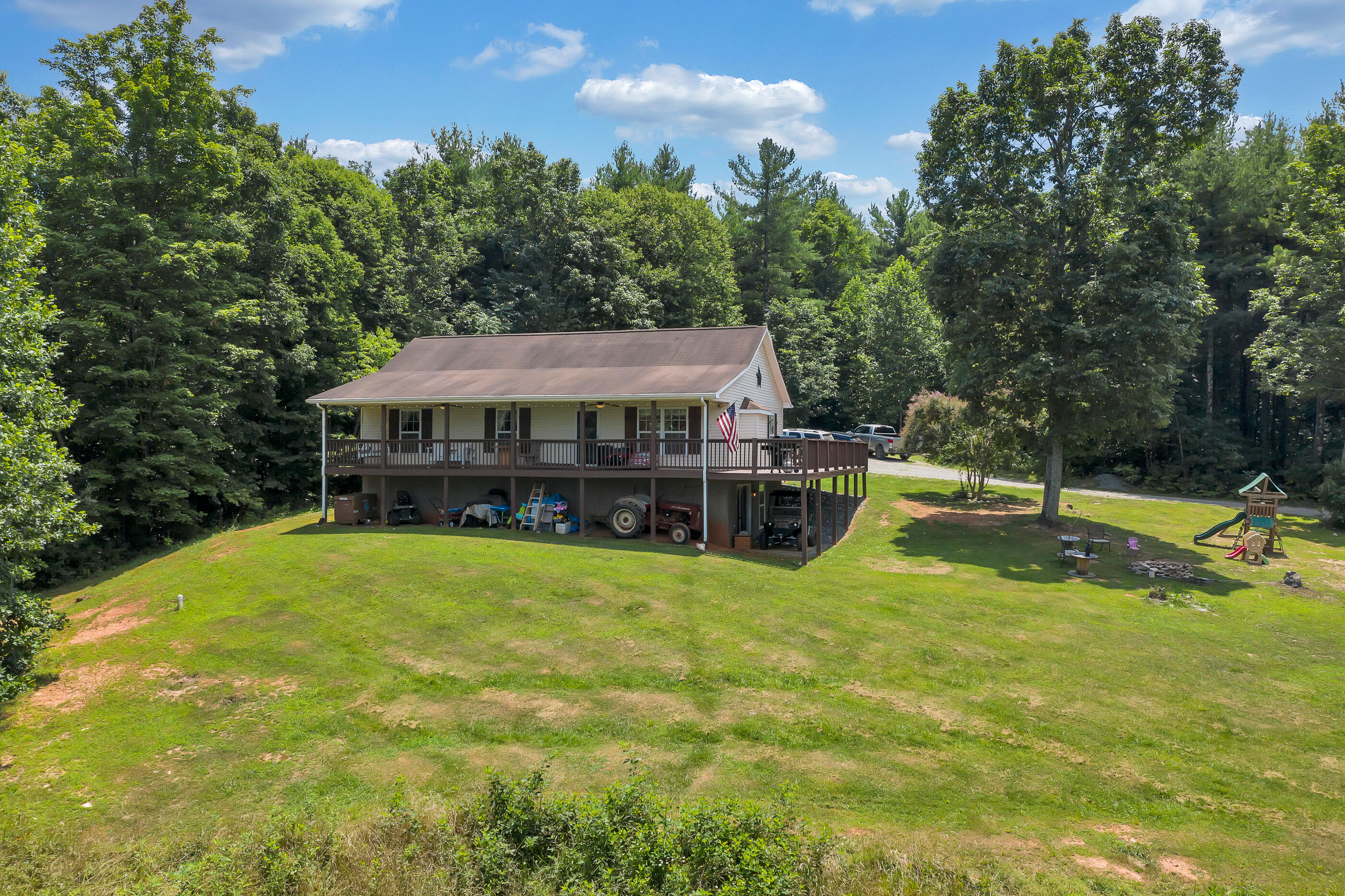 1145 Madcap Road Rocky Mount, VA 24151 - Photo 1 of 38 a view of a house with swimming pool and sitting area